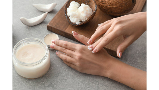 Applying coconut butter to hands.