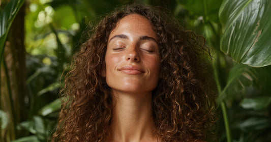 Woman's face in front of a tropical background